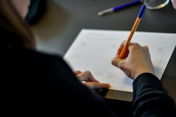 Student writing answers in a practice exam